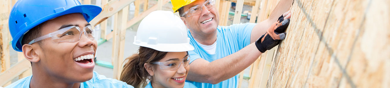 Young people helping build a house