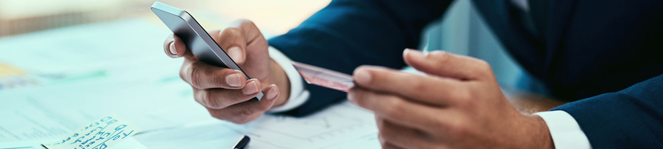 Businessman on phone with card