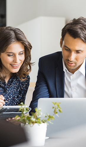 Business man and woman on a laptop